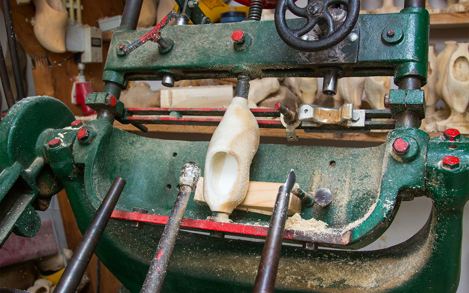 Wooden clog being crafted on a machine in Zaanse Schans, Netherlands.