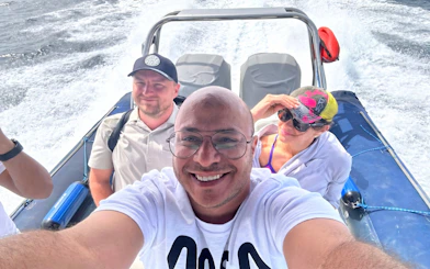 Group enjoying a high-speed sea taxi ride to Orange Bay or Magawish.