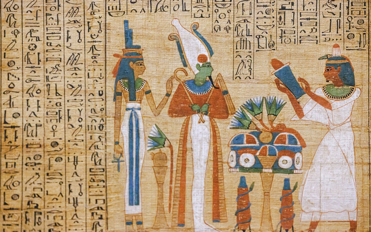 Ancient Egyptian hieroglyphs and deities depicted in Luxor Temple Valley of the Kings interior.