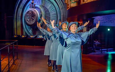 Performers in blue costumes at Triwizard Tournament, Warner Bros. Studio Tour London.