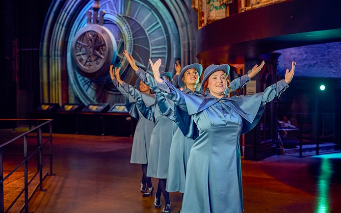 Performers in blue costumes at Triwizard Tournament, Warner Bros. Studio Tour London.