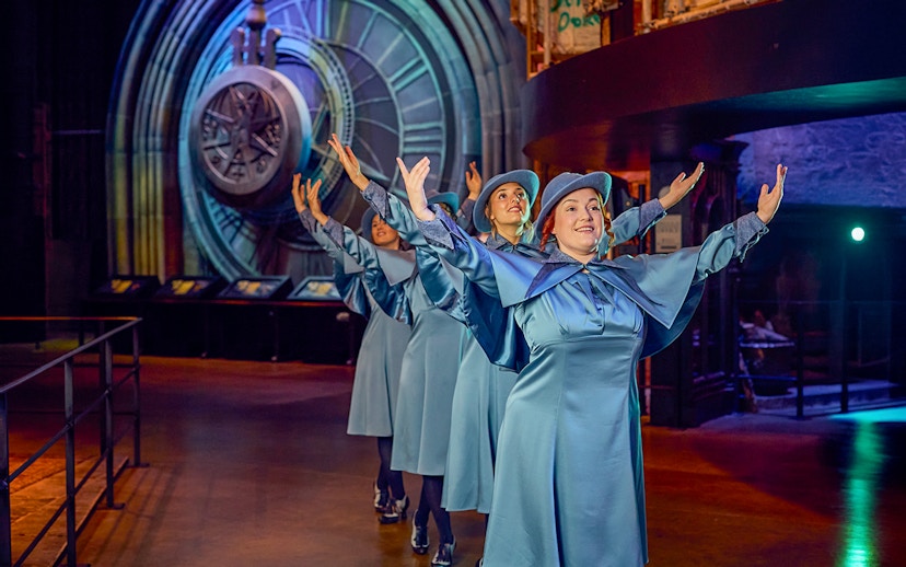 Performers in blue costumes at Triwizard Tournament, Warner Bros. Studio Tour London.