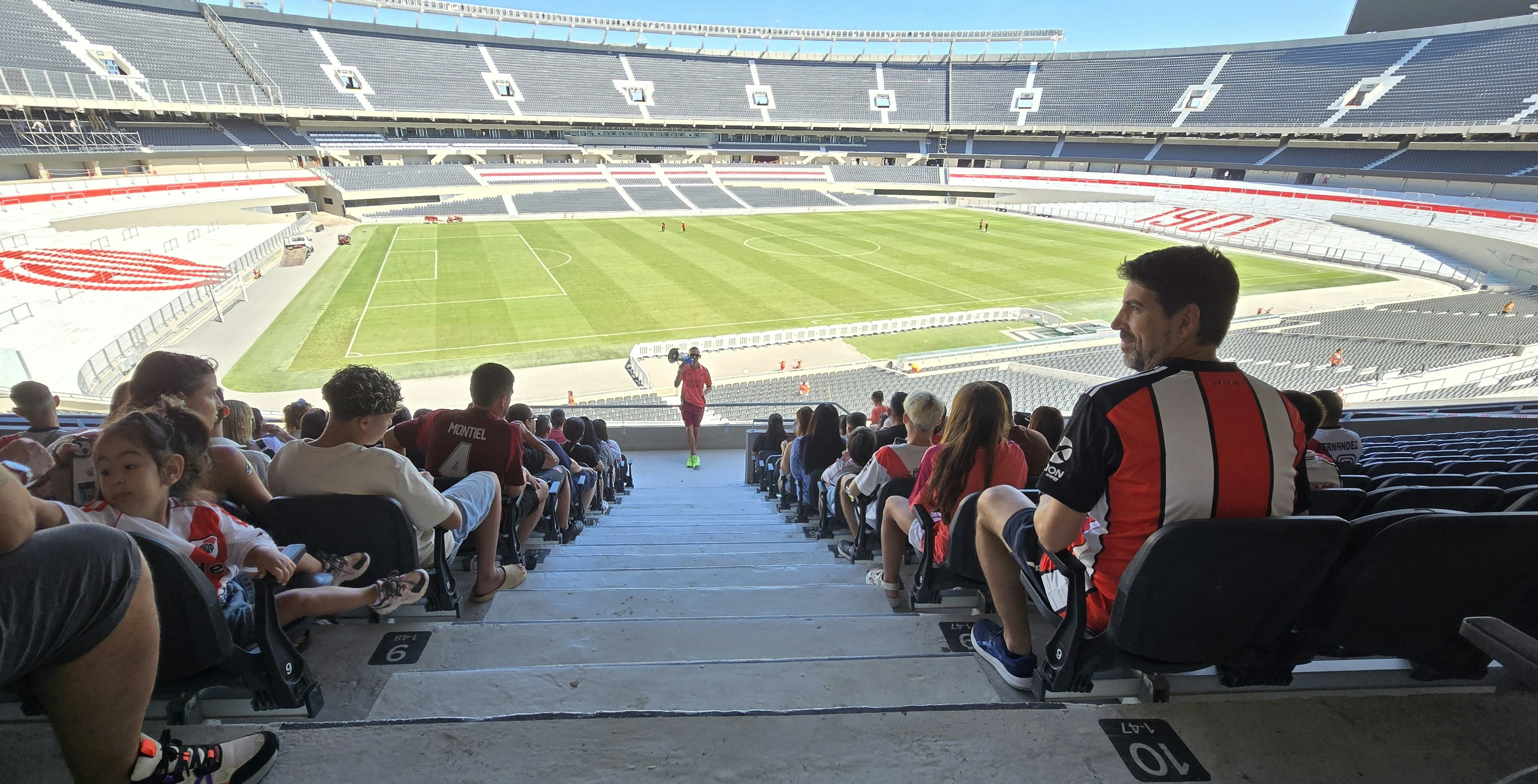 Spectators seated inside River Plate stadium overlooking the soccer field in Buenos Aires.