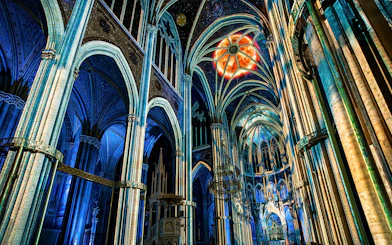 Votivkirche interior with colorful light projections, Vienna.