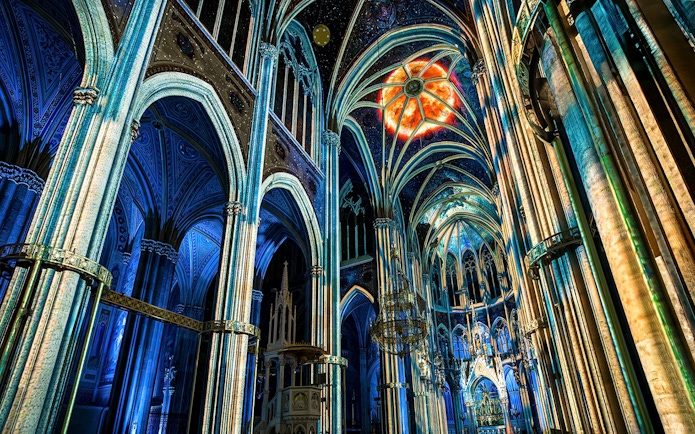Votivkirche interior with colorful light projections, Vienna.