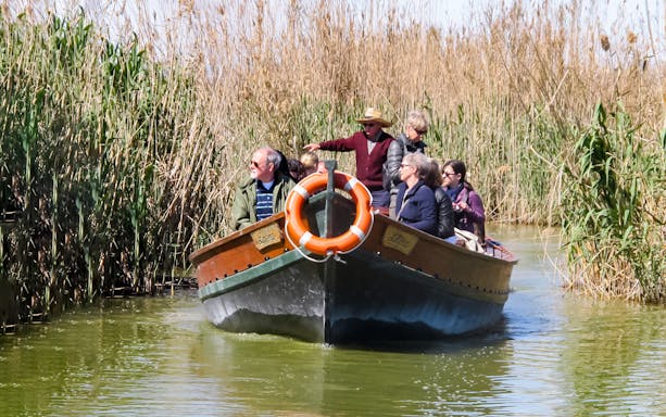 Boat ride through reeds at Albufeira Natural Park.