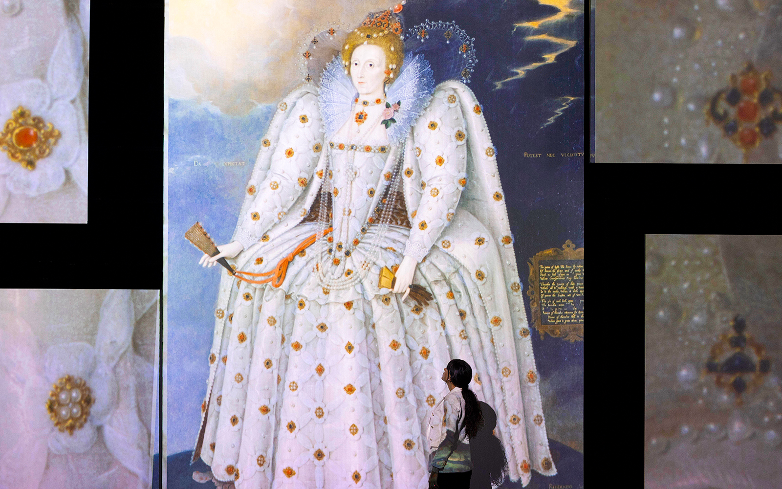 Visitor viewing a large portrait of Queen Elizabeth I at the Frameless National Portrait Gallery Exhibition.