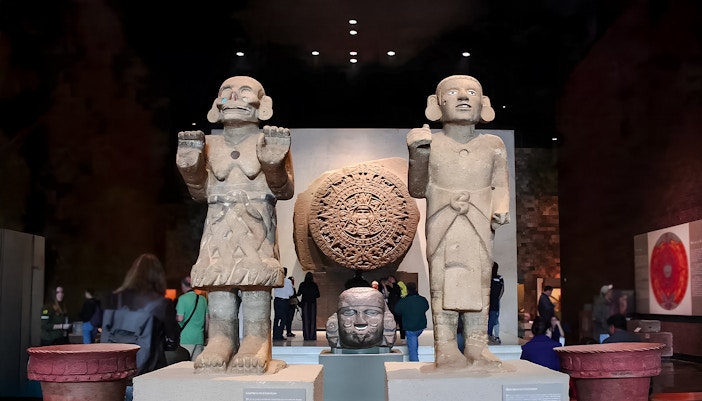 Visitors exploring exhibits at the Anthropology Museum, Mexico City.