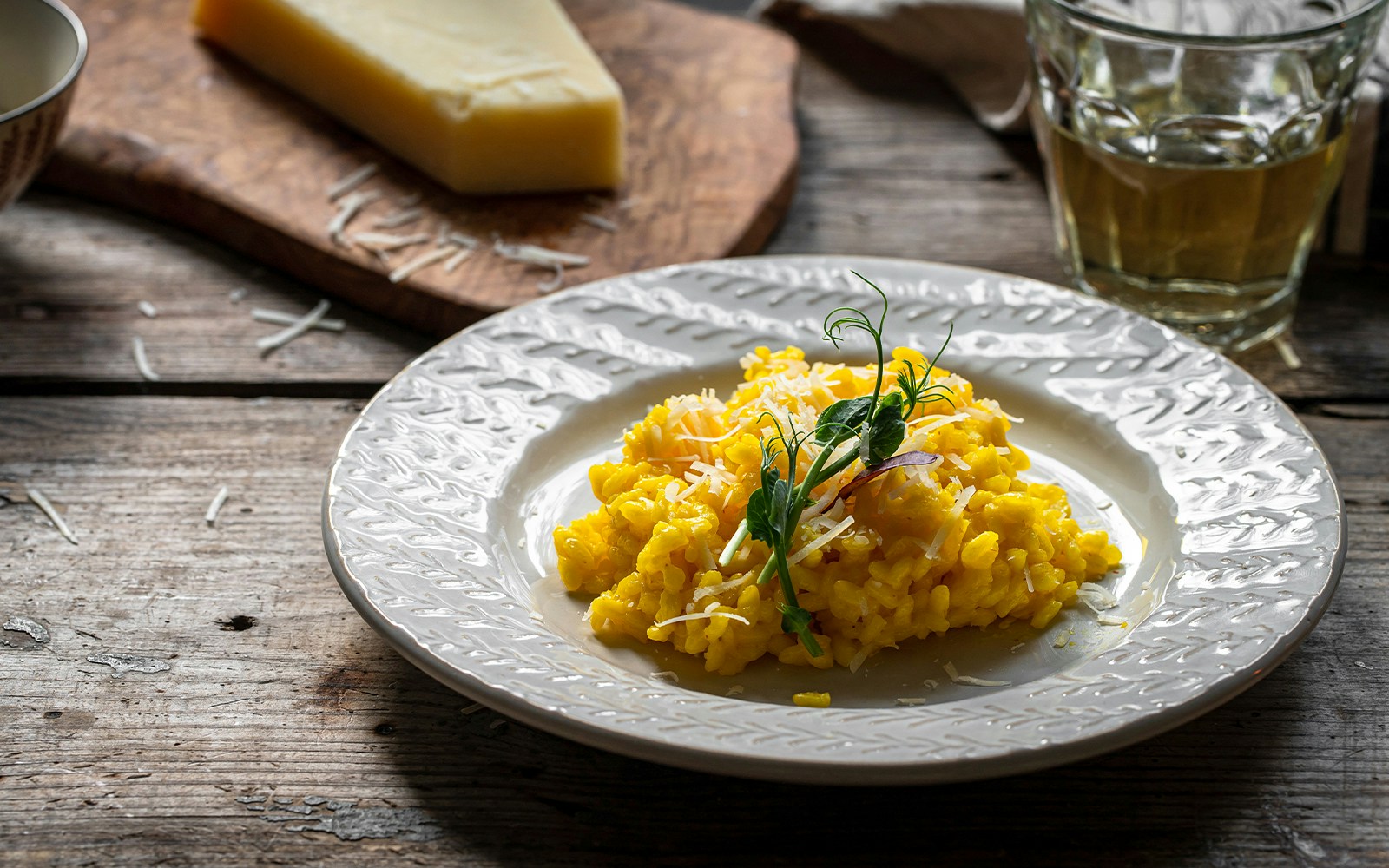 Creamy risotto dish served on a food tour in Milan.