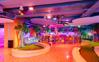 Indoor play area at Dora's Rainforest, Nickelodeon Play Tersane Istanbul, featuring Boots' Flower Spin ride.