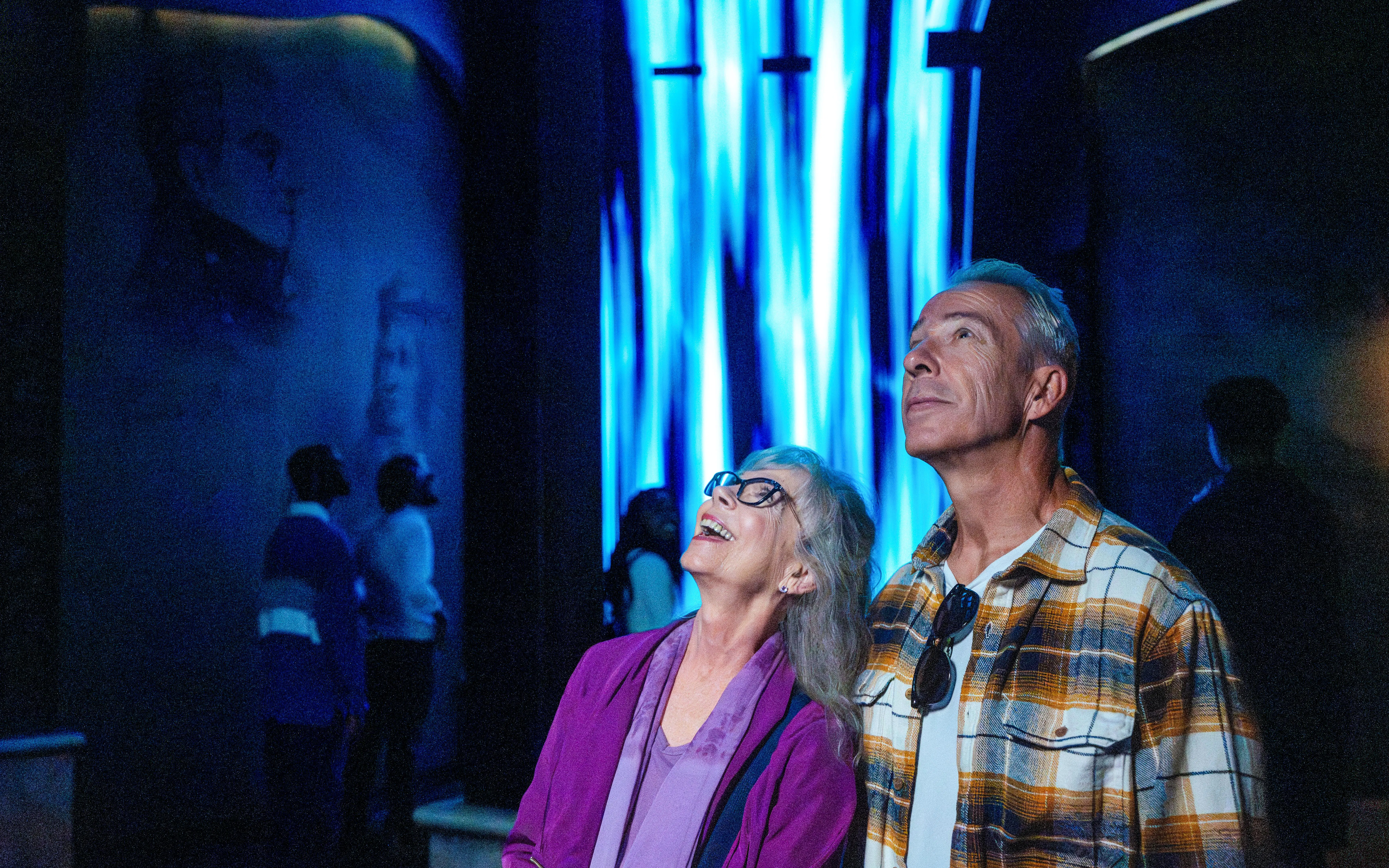 Visitors enjoying an immersive light display at Niagara Takes Flight, Canada.