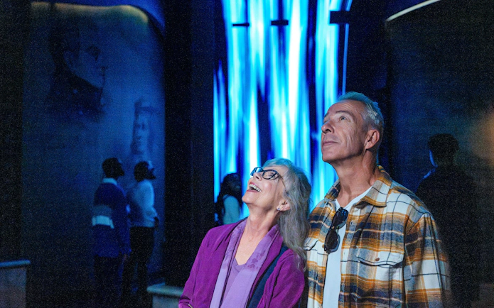 Visitors enjoying an immersive light display at Niagara Takes Flight, Canada.