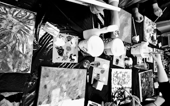 Participants painting canvases at a Barcelona sip and paint night with art supplies and drinks.