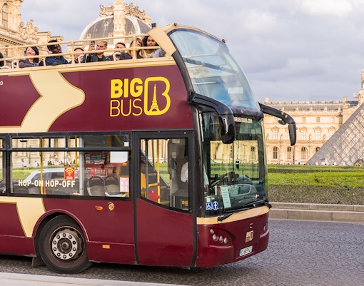 Tourists entering the Pantheon in Paris via Big Bus tour