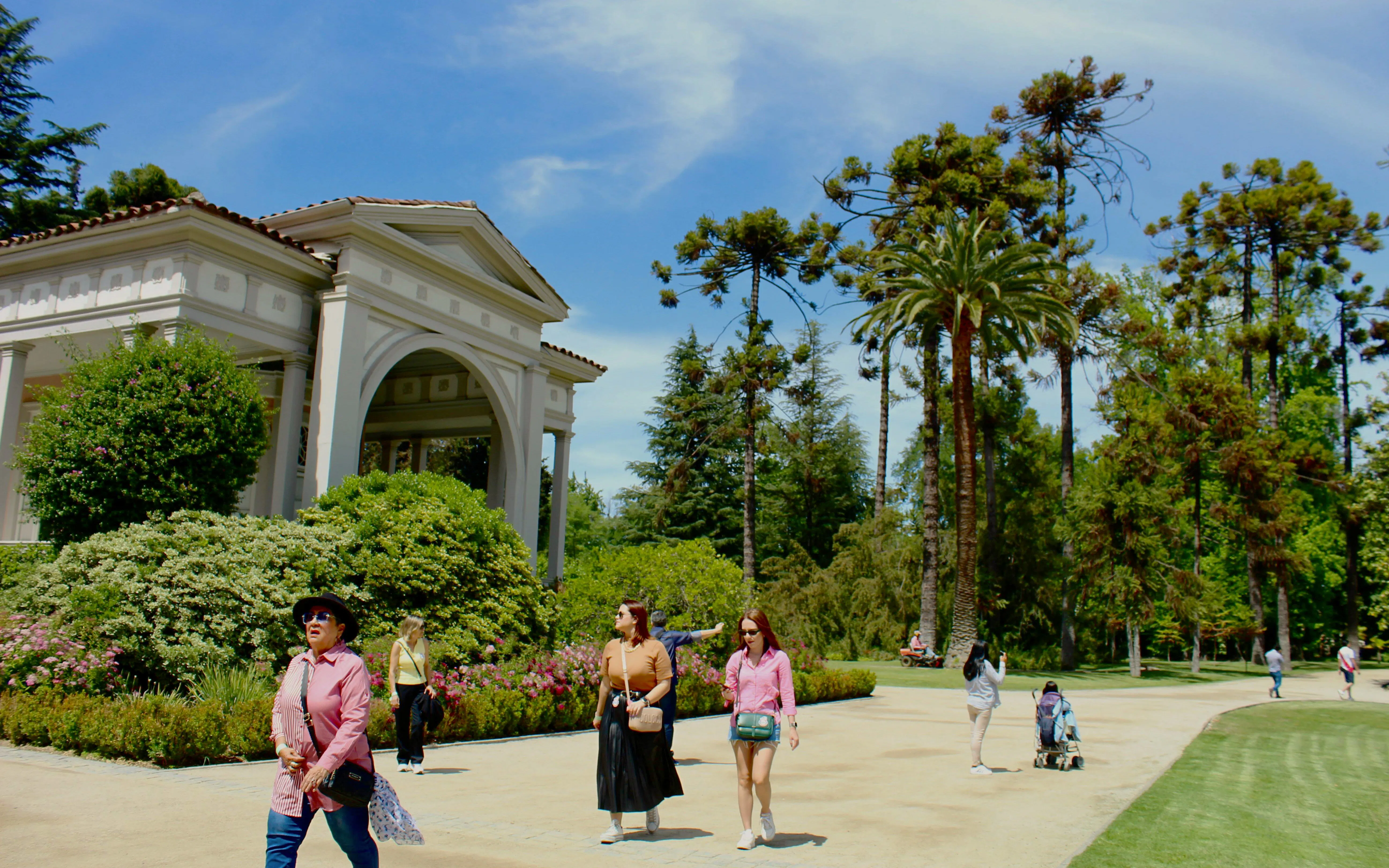 Visitors walking through the gardens at Concha y Toro Winery, Chile.