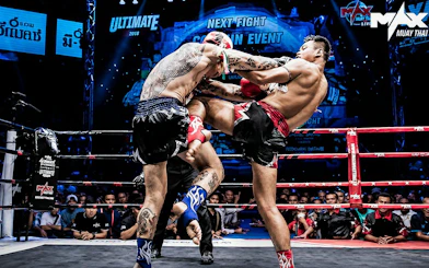 Fighters engage in a Muay Thai match at MAX Muay Thai Stadium Pattaya.