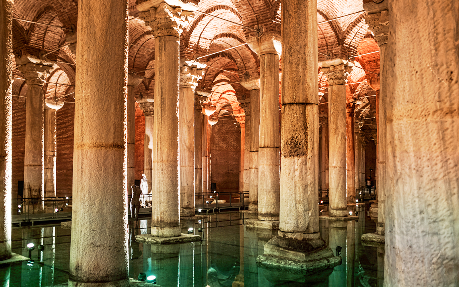Basilica Cistern's illuminated columns and arches in Istanbul.