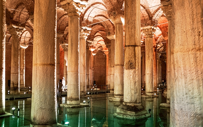 Basilica Cistern's illuminated columns and arches in Istanbul.