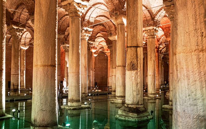 Basilica Cistern's illuminated columns and arches in Istanbul.