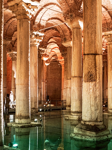 Basilica Cistern's illuminated columns and arches in Istanbul.