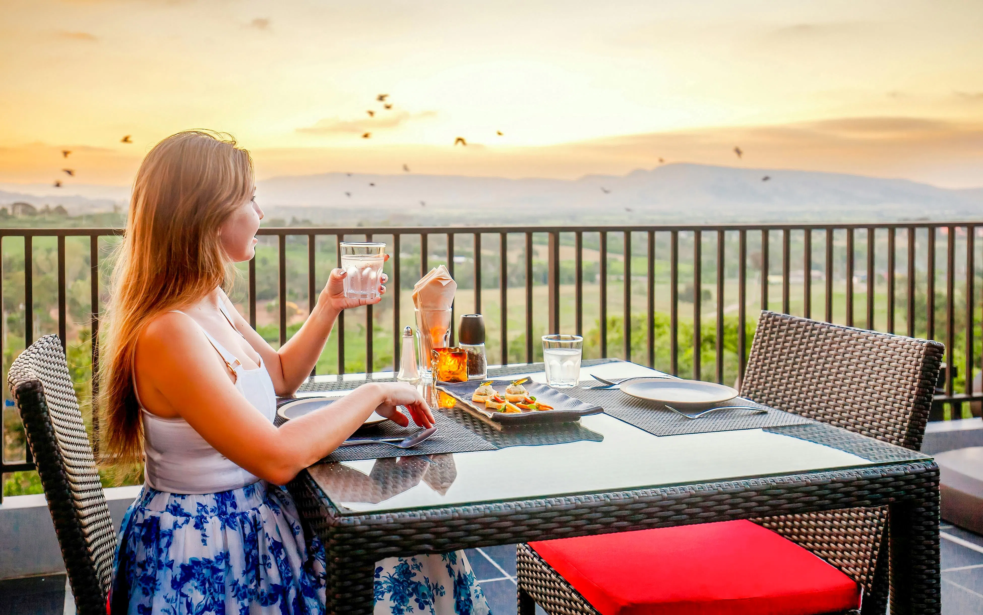 Dining with a view of the Delphi landscape at sunset, Greece.