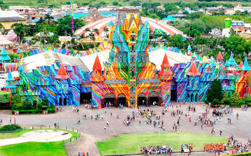 Colorful entrance of Beto Carrero World theme park with visitors, Santa Catarina, Brazil.