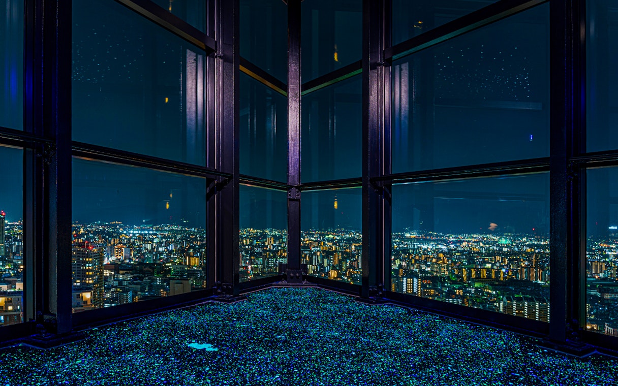 View of Fukuoka cityscape at night from Fukuoka Tower observation deck.