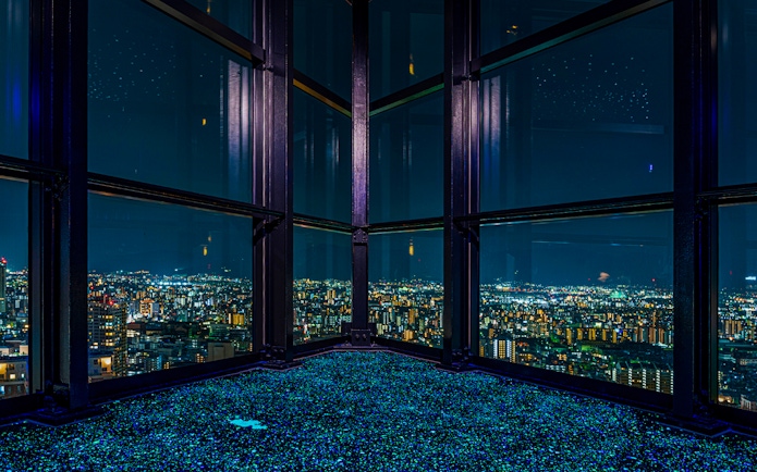 View of Fukuoka cityscape at night from Fukuoka Tower observation deck.