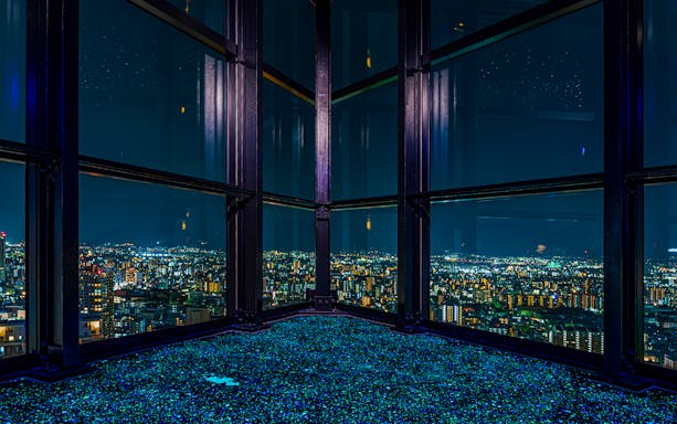 View of Fukuoka cityscape at night from Fukuoka Tower observation deck.
