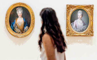 Visitor viewing portraits at National Gallery of Victoria during Best of NGV Experiences Tour.