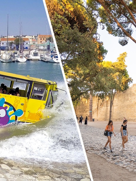 Bus entering water at Lisbon marina during sightseeing tour.