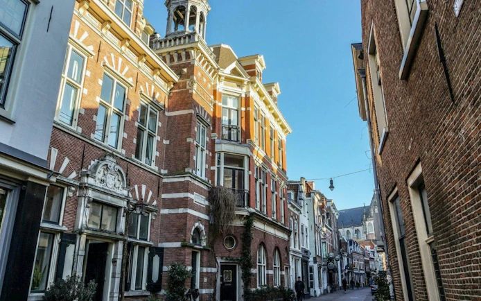 Historic architecture on a street in Haarlem during a walking tour.