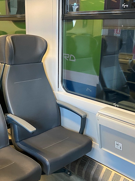 Train seats on route between Milan Malpensa Airport and Milan Central Station.