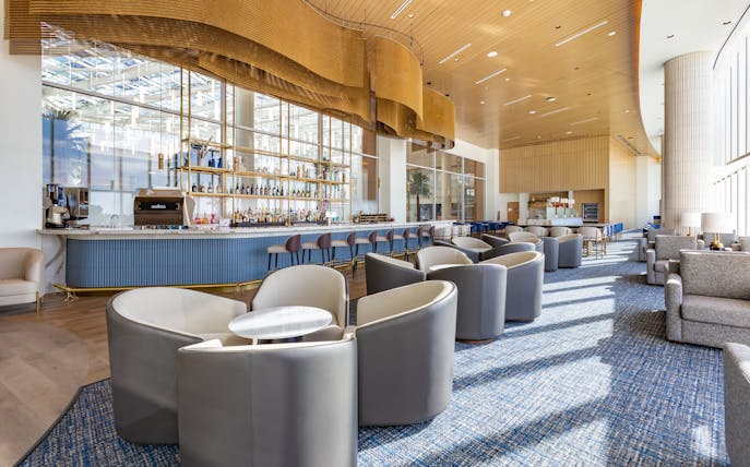 Bar seating area at Plaza Premium Lounge, Orlando Airport Terminal C.