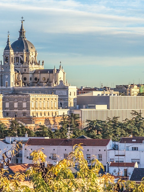 Royal Palace of Madrid and Almudena Cathedral viewed from a distance.