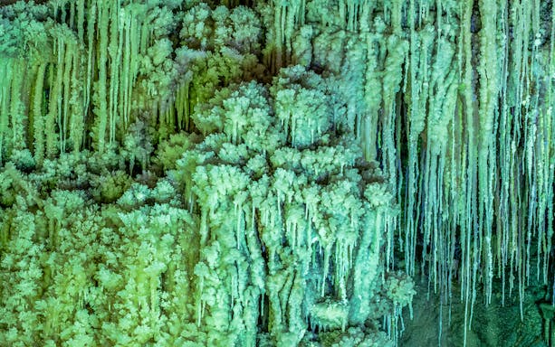 Stalactites and stalagmites in Slanic Salt Mine, Romania.