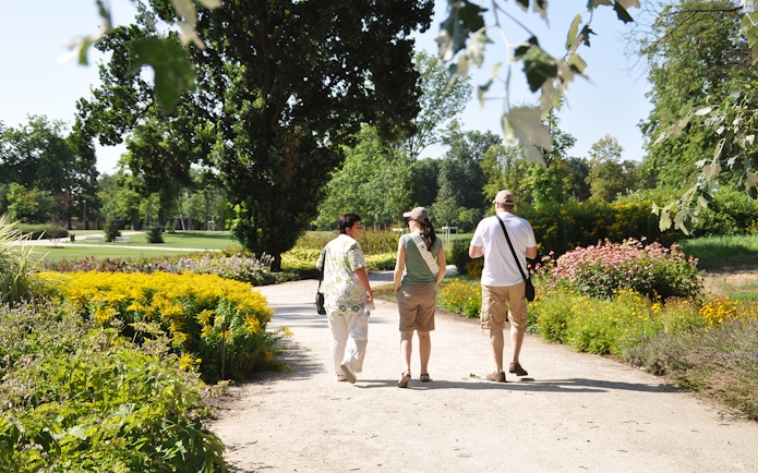 Visitors walking through gardens at Gödöllő Royal Palace near Budapest.