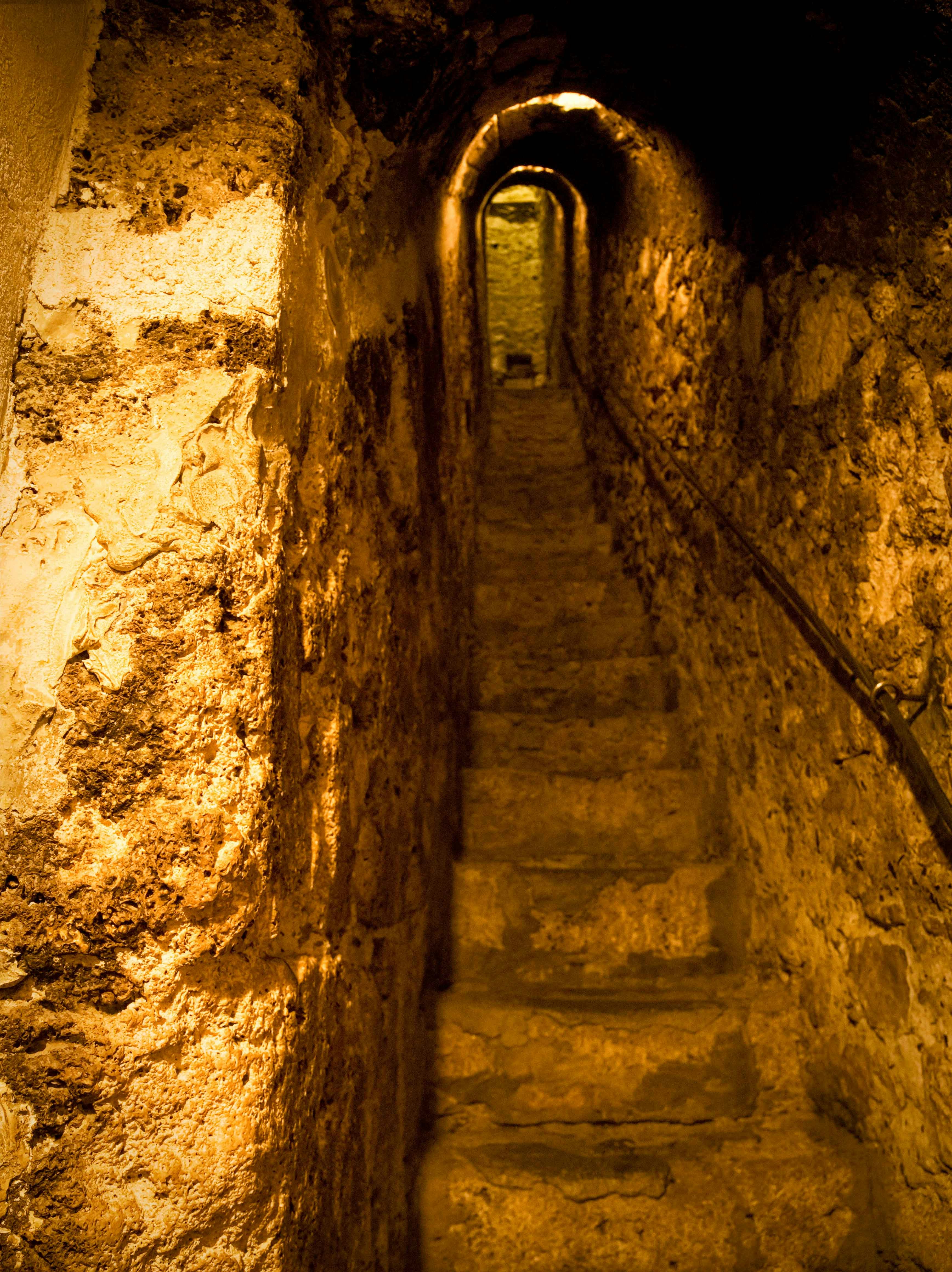 Narrow stone staircase inside Bran Castle, Romania.