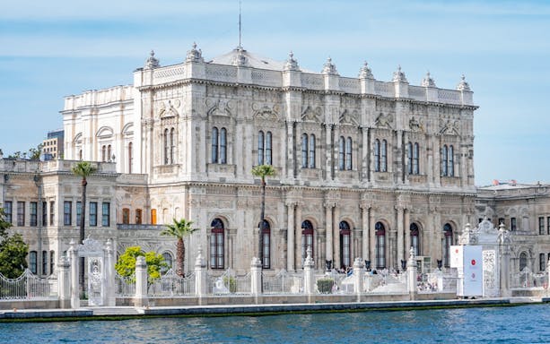 Dolmabahçe Palace view from Bosphorus during afternoon cruise in Istanbul.