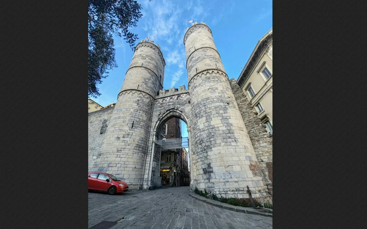 Medieval gate towers in Genoa, part of the self-guided city exploration game.