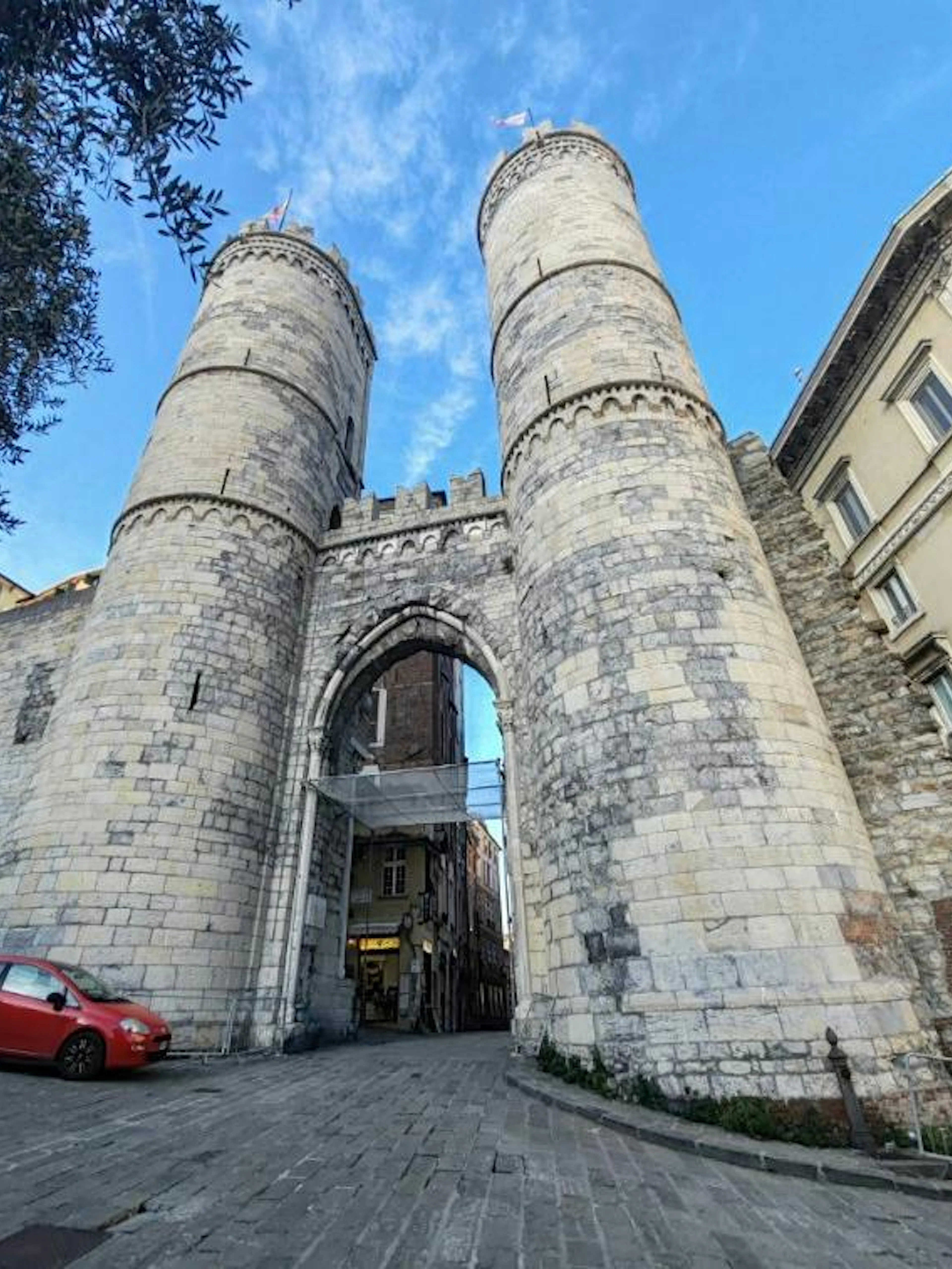 Medieval gate towers in Genoa, part of the self-guided city exploration game.