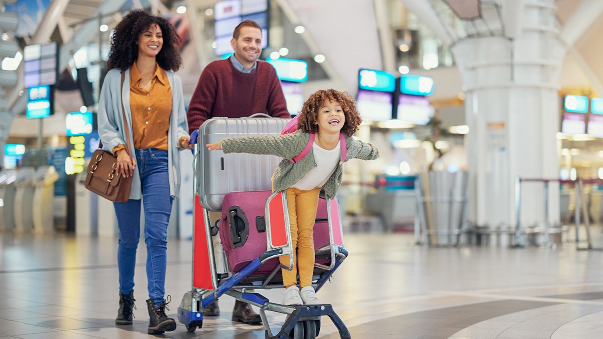 Family with luggage at Honolulu International Airport