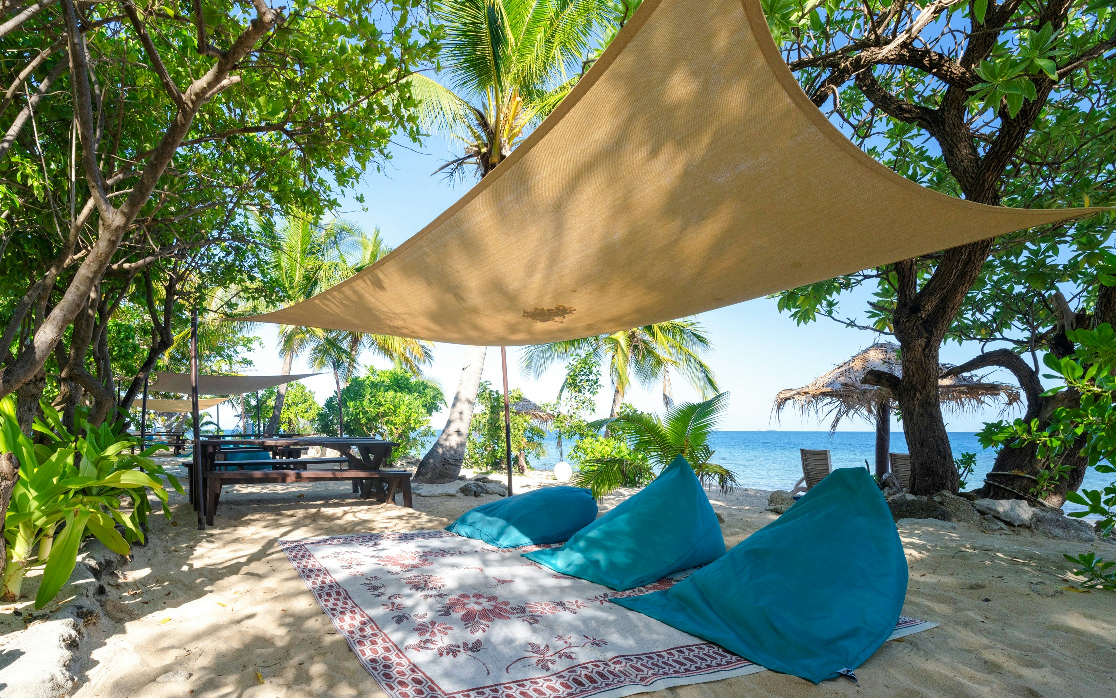 Seating arrangement with shade on South Sea Island beach, Fiji.