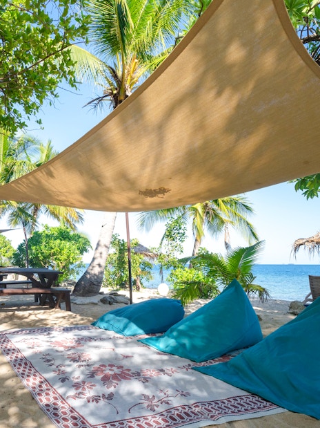 Seating arrangement with shade on South Sea Island beach, Fiji.