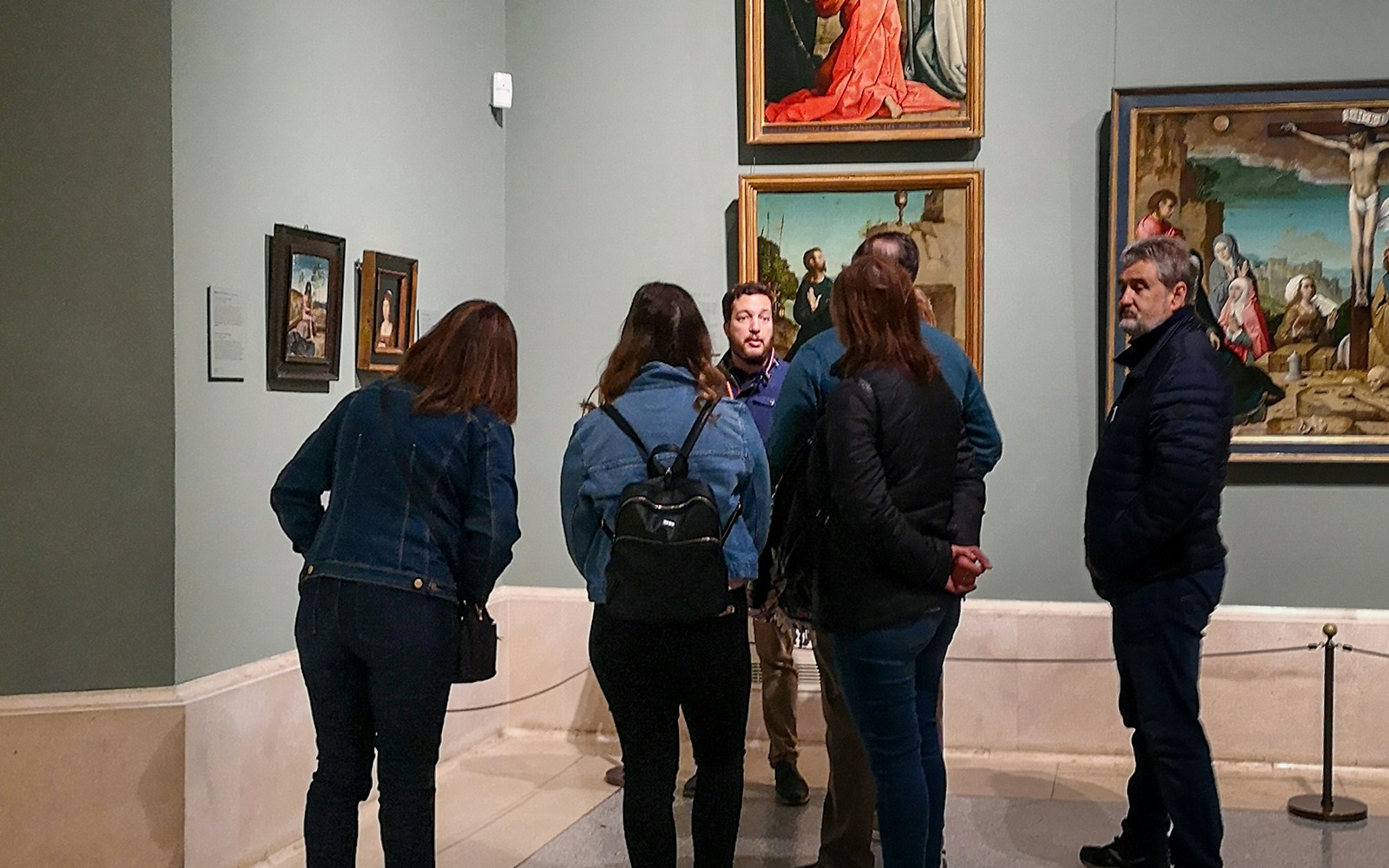 Group touring art gallery in Prado Museum, Madrid.