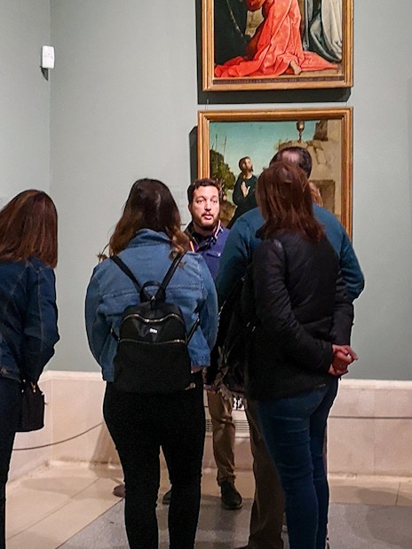 Group touring art gallery in Prado Museum, Madrid.