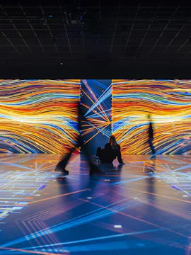 Guests exploring digital exhibits at Signal Space Digital Art Gallery.