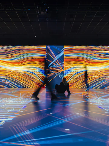 Guests exploring digital exhibits at Signal Space Digital Art Gallery.