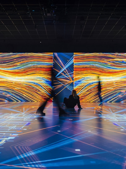 Guests exploring digital exhibits at Signal Space Digital Art Gallery.