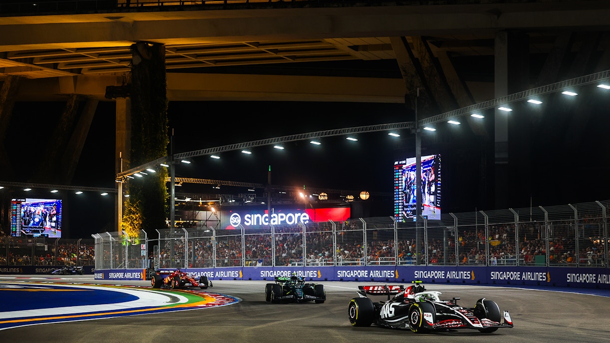 Haas' Nico Hulkenberg leads Aston Martin's Fernando Alonso, and Ferrari's Charles Leclerc at F1 Singapore